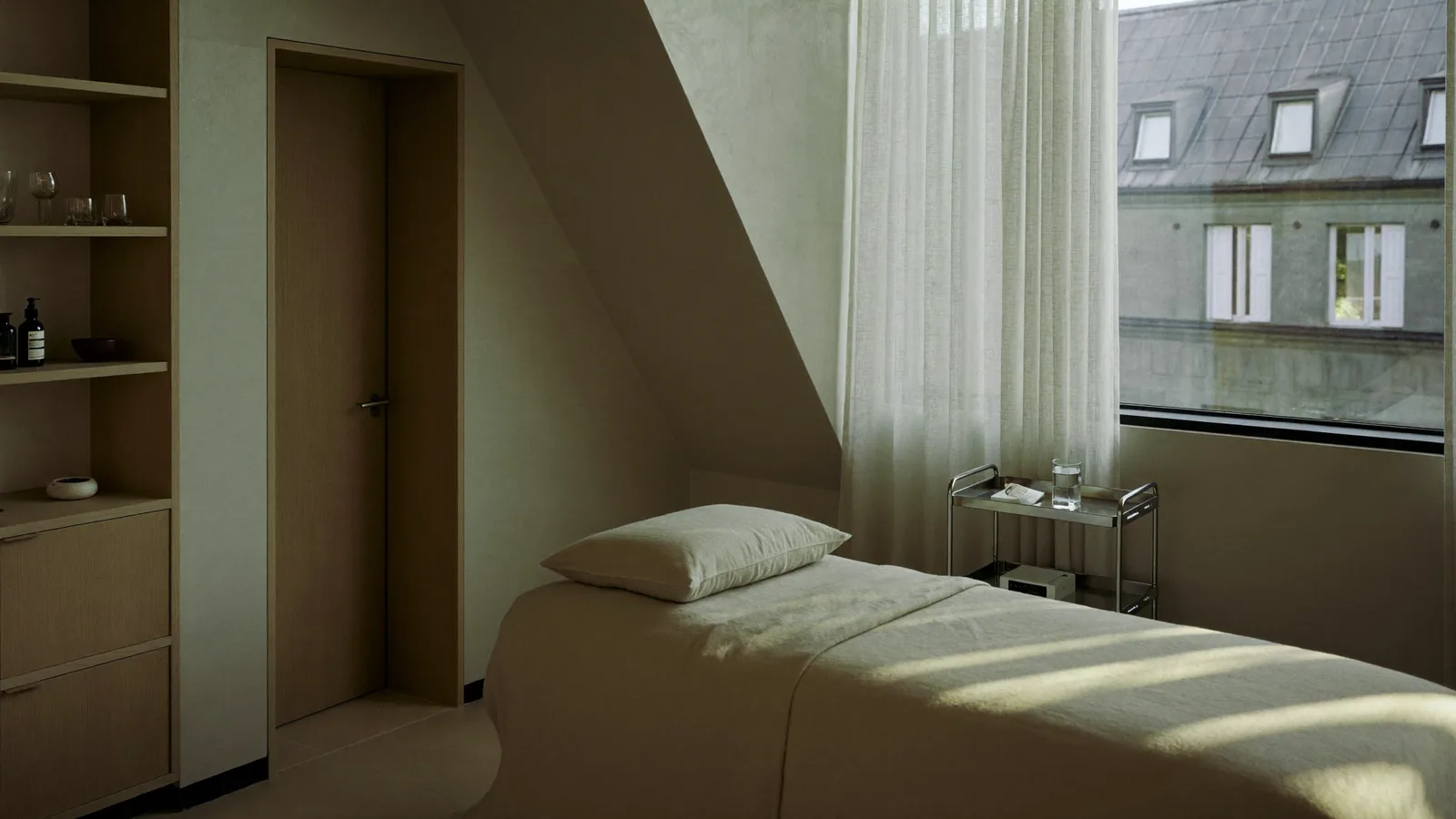 The clinic corridor with linen curtains filtering morning light