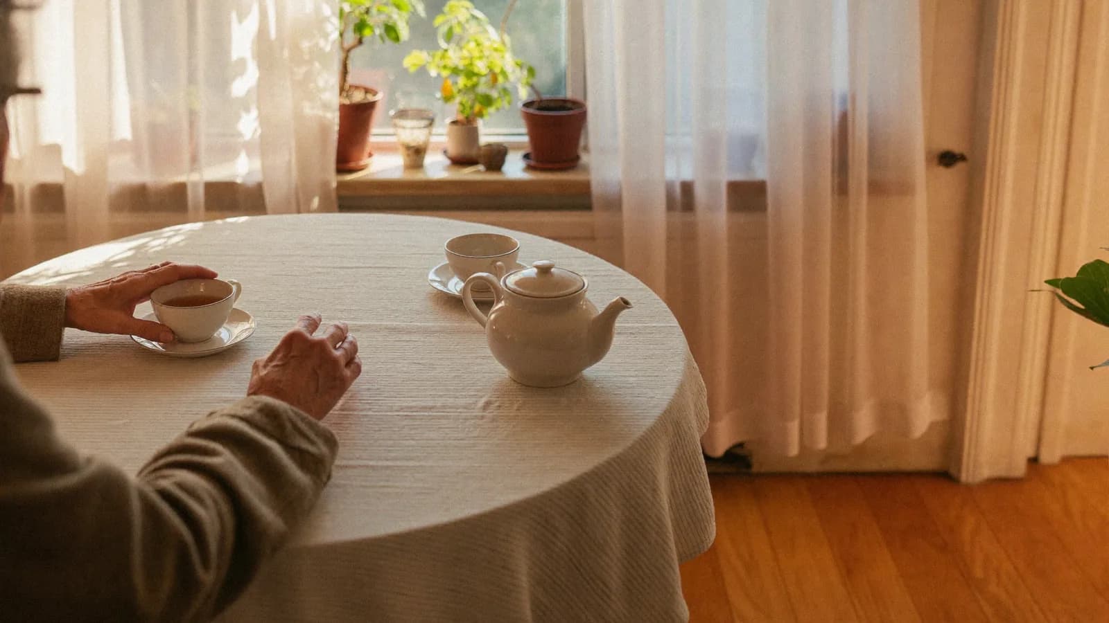 An afternoon at the kitchen table, tea poured for two