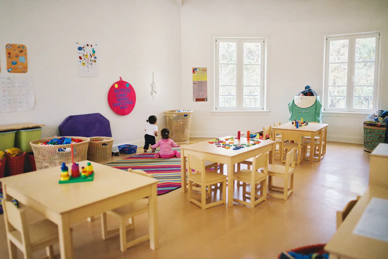 Children playing together in the nursery garden