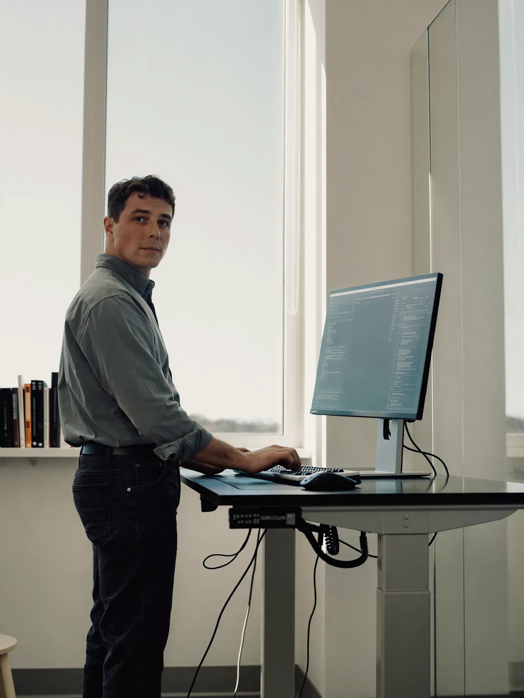An engineer at a workstation reviewing a running service